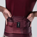 Gobik Magnitude cycling jersey in burgundy showing back pocket detail with brand label