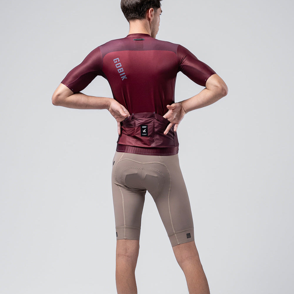 Gobik Magnitude short sleeve cycling jersey in Barossa burgundy color, rear view