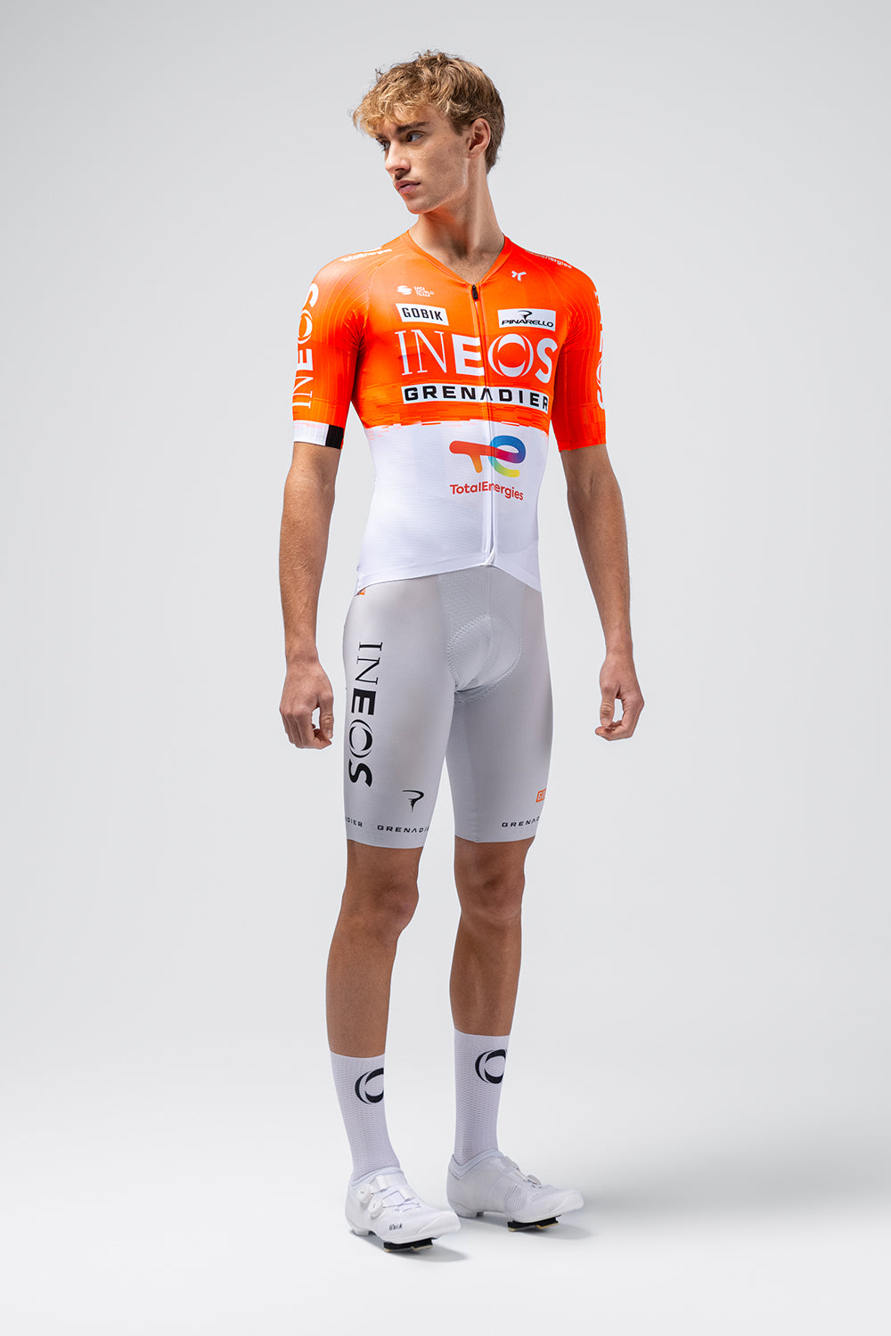 Gobik cycling jersey in orange Ineos Grenadiers team colors with matching shorts