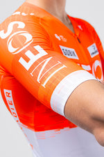 Gobik Reactive 2.0 cycling jersey in orange Ineos Grenadiers colorway on model