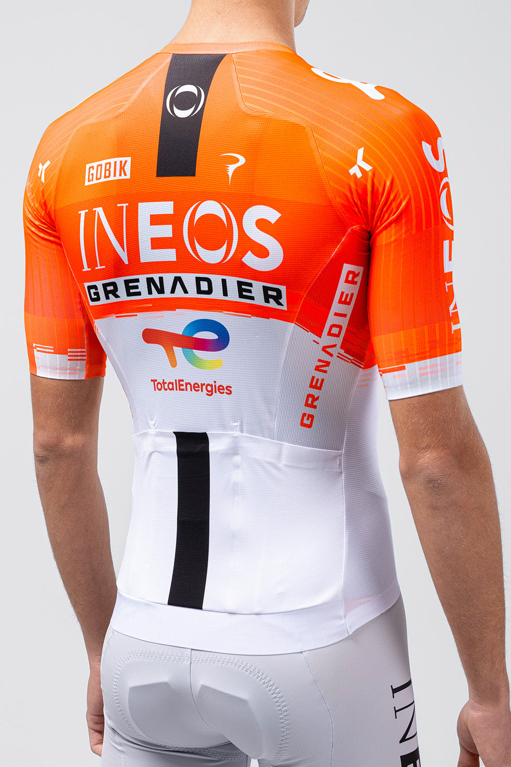 Gobik cycling jersey in Ineos Grenadiers orange and white team colors, rear view