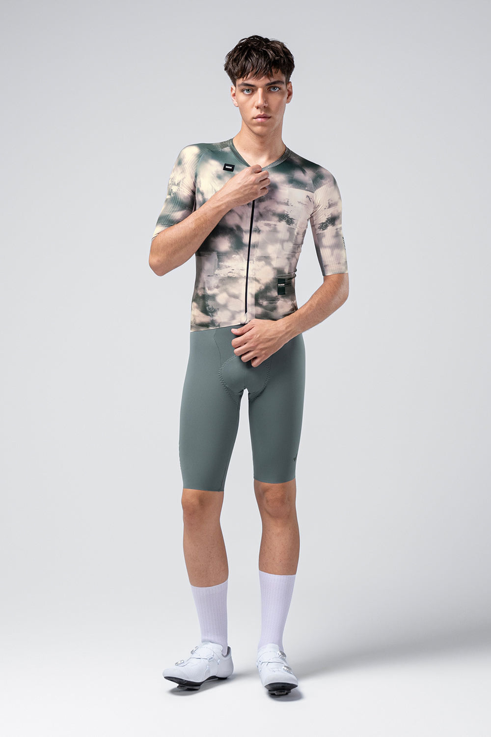 Male model wearing Gobik Reactive short sleeve cycling jersey in Bush colorway with matching shorts
