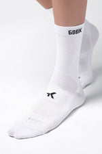White Gobik Icon cycling socks with black logo branding on clean studio background