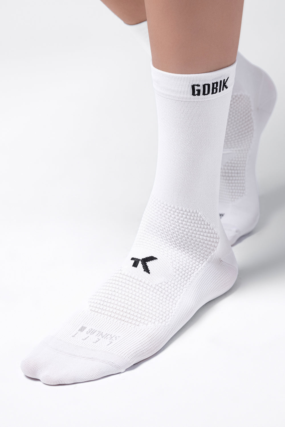 White Gobik Icon cycling socks with black logo branding on clean studio background