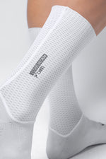 White Gobik Vortex 2.0 cycling socks with textured mesh pattern on feet
