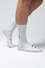 White Gobik Vortex 2.0 cycling socks with mesh texture worn on feet