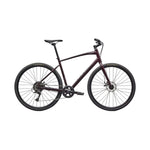 Specialized Sirrus X 1.0 hybrid bike in burgundy metallic finish with disc brakes