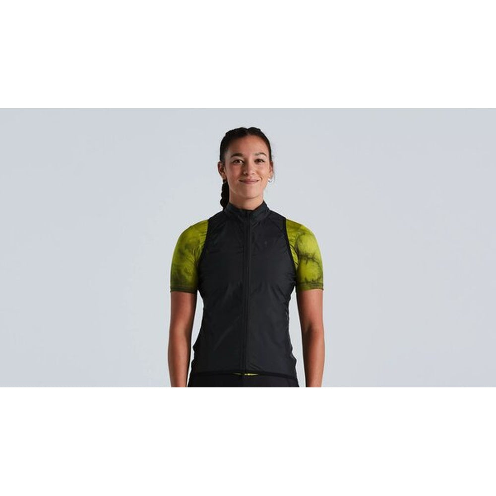 Woman wearing black and lime green cycling vest with short sleeves