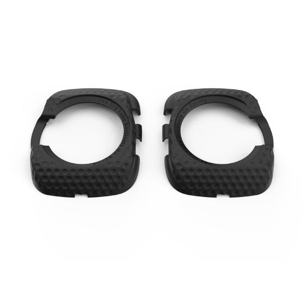 Two black Wahoo Speedplay cleat covers with textured surface on white background
