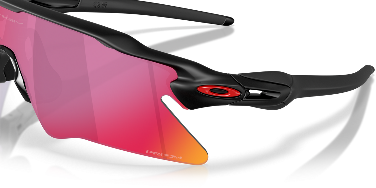 Close-up detail of Oakley Radar EV Heater hinge with Prizm Road lens and matte black frame