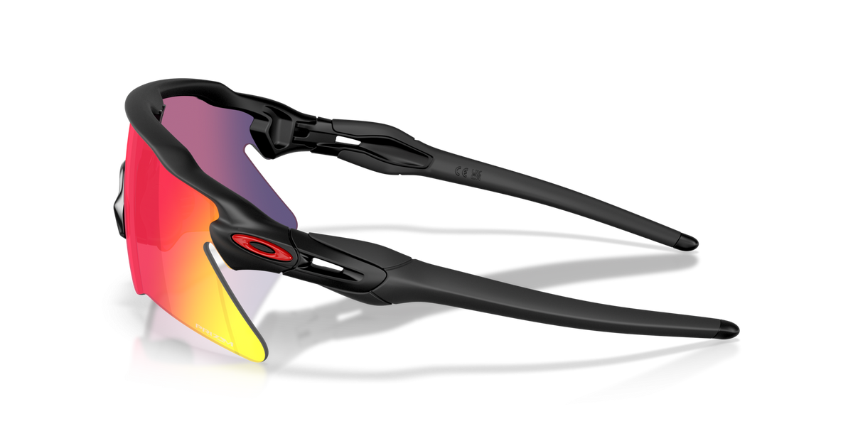 Oakley Radar EV Heater sunglasses side view with reflection showing matte black frame and Prizm Road lens