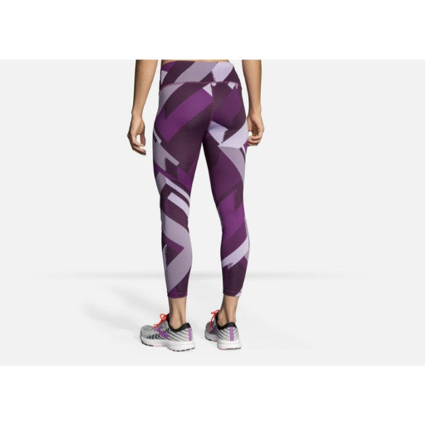 Brooks Formation Compressive Crop leggings in purple geometric camouflage pattern on model