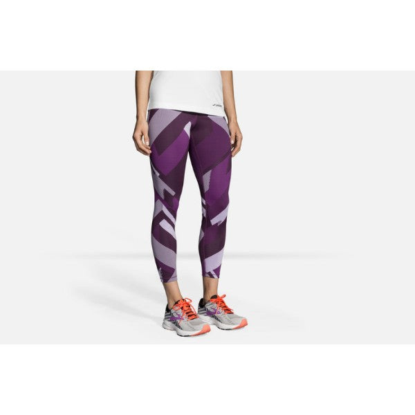 Brooks Formation Compressive Crop leggings in purple geometric pattern on model