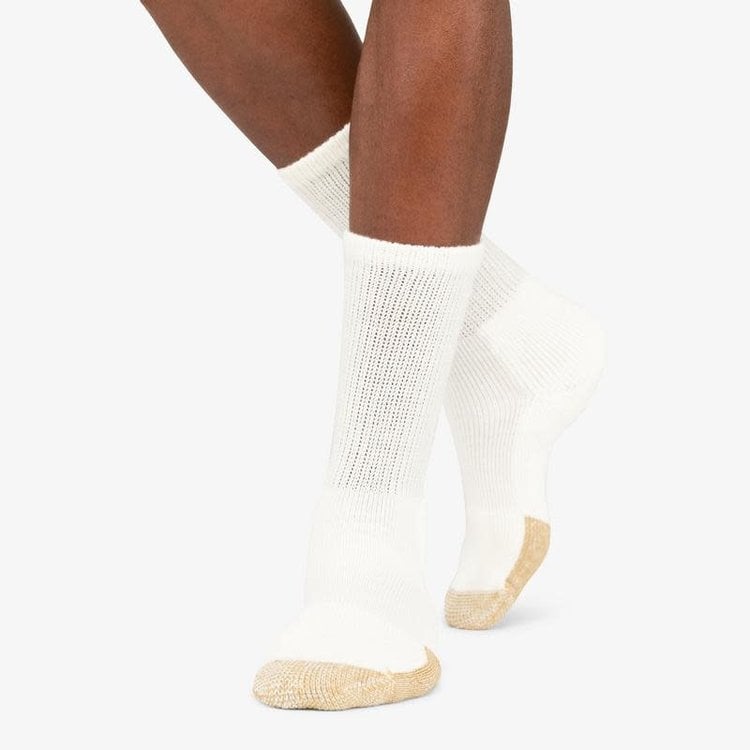 Thorlos white mini crew tennis socks with gold cushioned toe and heel on model