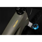 Close-up of Santa Cruz Tallboy bike frame showing yellow Tallboy branding on olive green frame