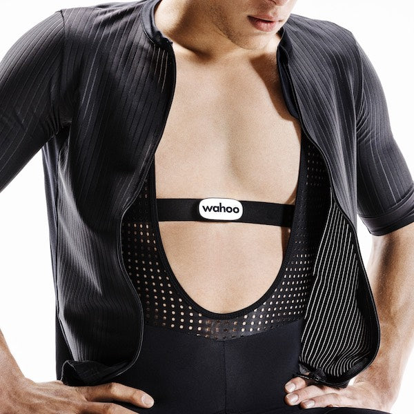 Man wearing black Wahoo TRACKR heart rate monitor chest strap during workout