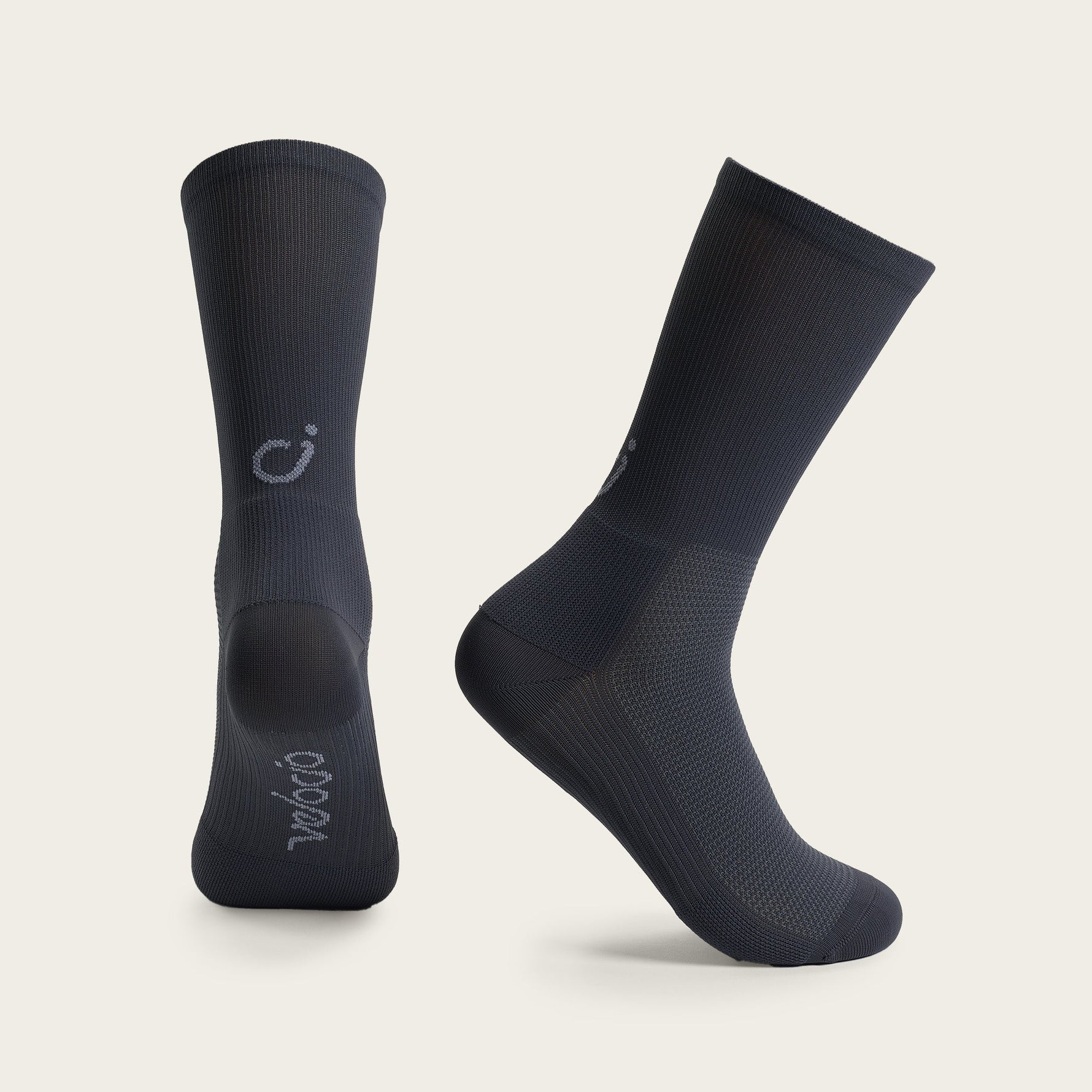 Velocio black cycling socks shown from side and front view on clean background