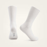 White Velocio ultralight cycling socks on neutral background studio photograph