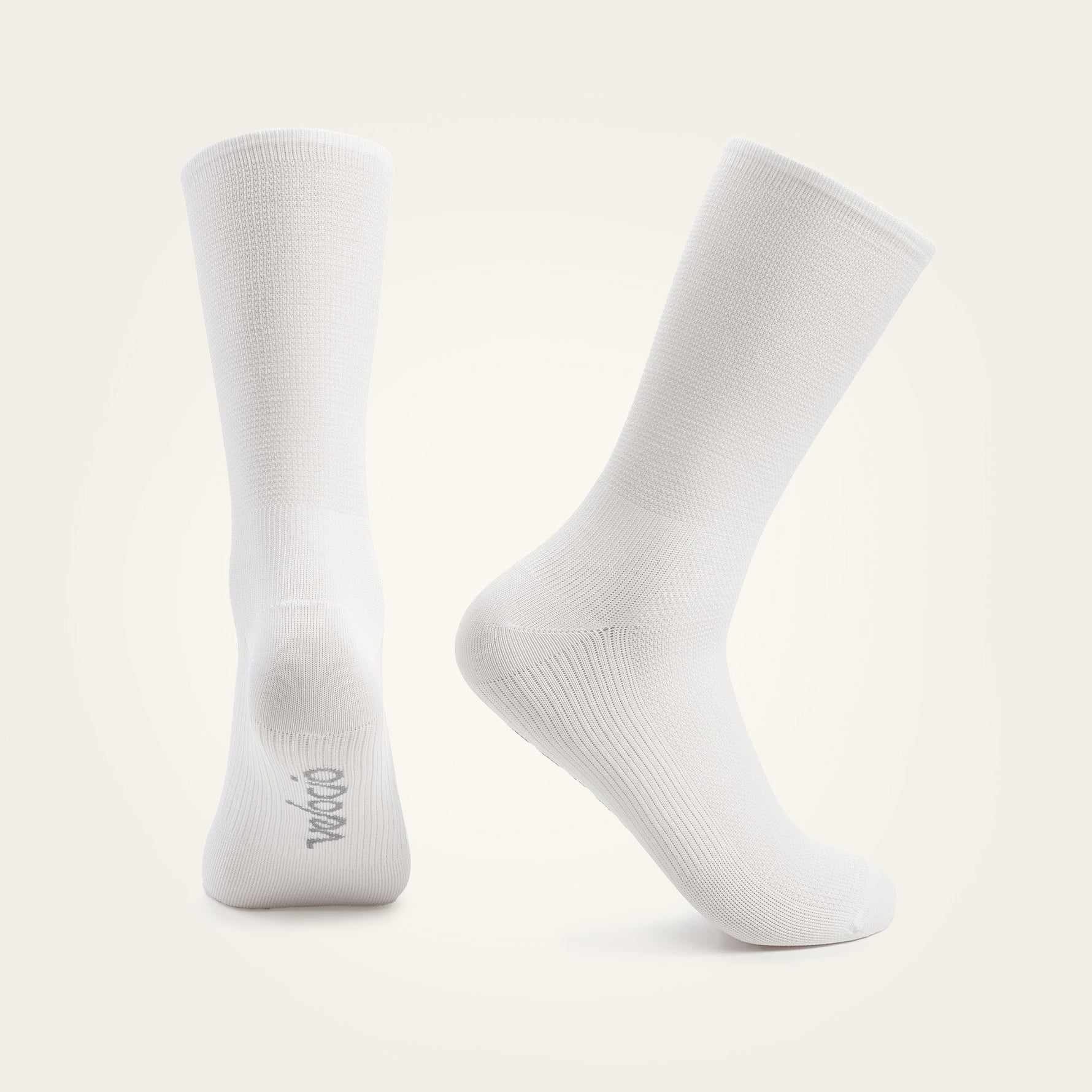 White Velocio ultralight cycling socks displayed on clean studio background