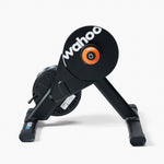 Wahoo KICKR CORE smart bike trainer in black with orange flywheel on white background