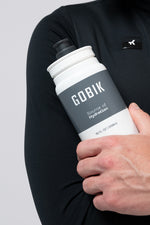 GOBIK water bottle with white and grey design held by person in black shirt