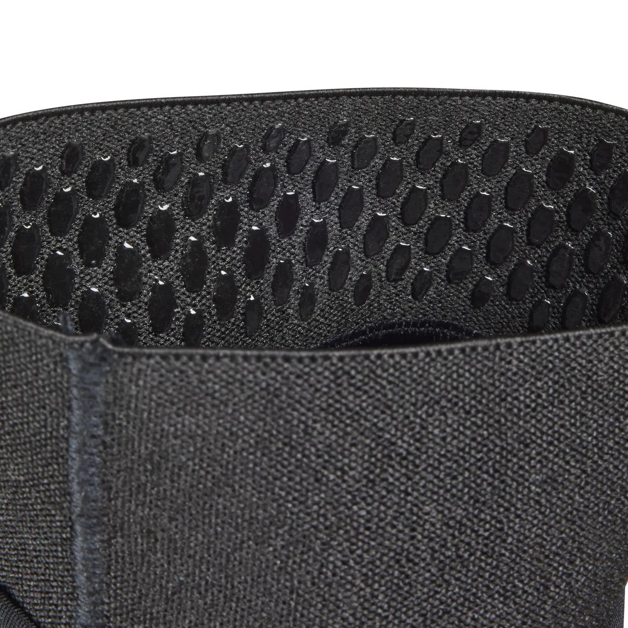 Close-up of black Fox Racing Launch Elite elbow pad showing ventilation holes and textured fabric