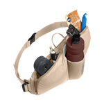 Tan waist pack with water bottle and cycling accessories on white background