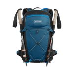 Camelbak Fourteener 26 blue hiking backpack with trekking poles and hydration reservoir
