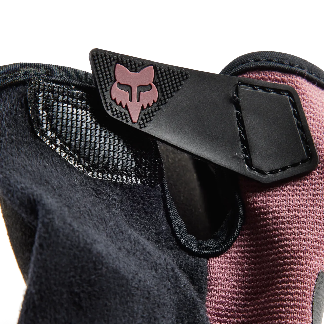 Fox Racing Ranger glove detail showing pink fox logo and black mesh construction