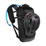 Black CamelBak Mule hydration backpack with helmet attached showing water tube