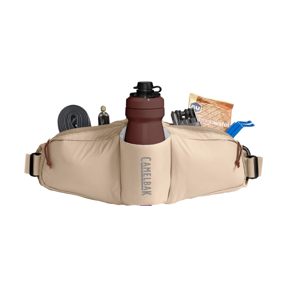 CamelBak tan waist pack with water bottle and cycling accessories on white background