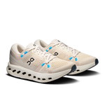 On Cloudsurfer women's running shoes in pearl ivory with blue laces and signature CloudTec sole