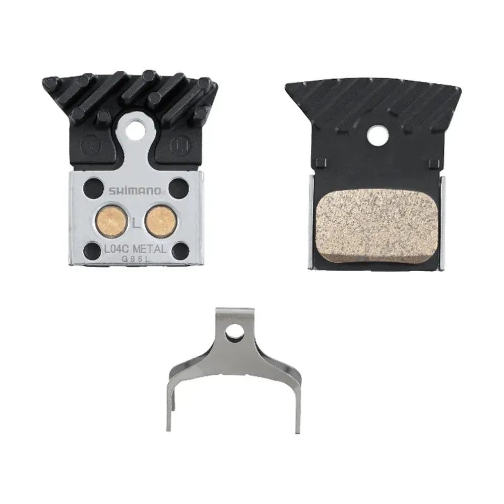 Shimano L04C metal disc brake pads with cooling fins, spring, and aluminum backing plate