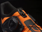 DMT KR2 road cycling shoe in black and fluorescent orange colorway with BOA dial